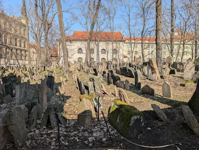 Old Jewish Cemetery in Prague, Czech Republic, with layered graves and crowded historic headstones